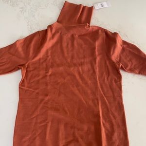 Burnt orange short sleeved turtleneck sweater